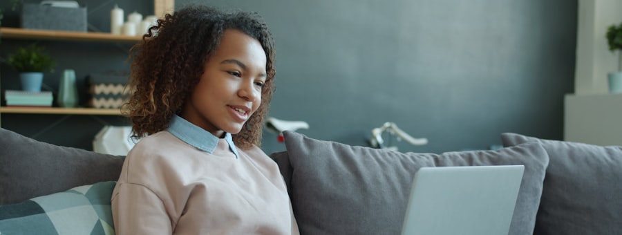 A woman sitting quietly with her laptop, unhurried